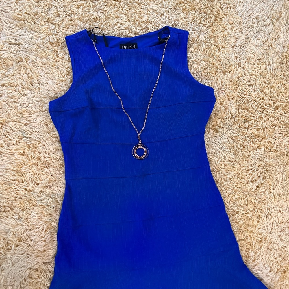 blue dress, fits wonderfully to the body